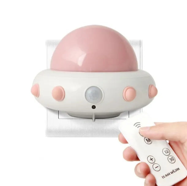 Remote control UFO shaped bedside night light in blue, pink or white colours