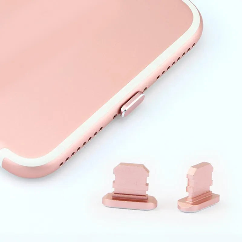 Aluminium alloy mobile phone charging port dust plug for iPhones, shown in rose gold colour.
