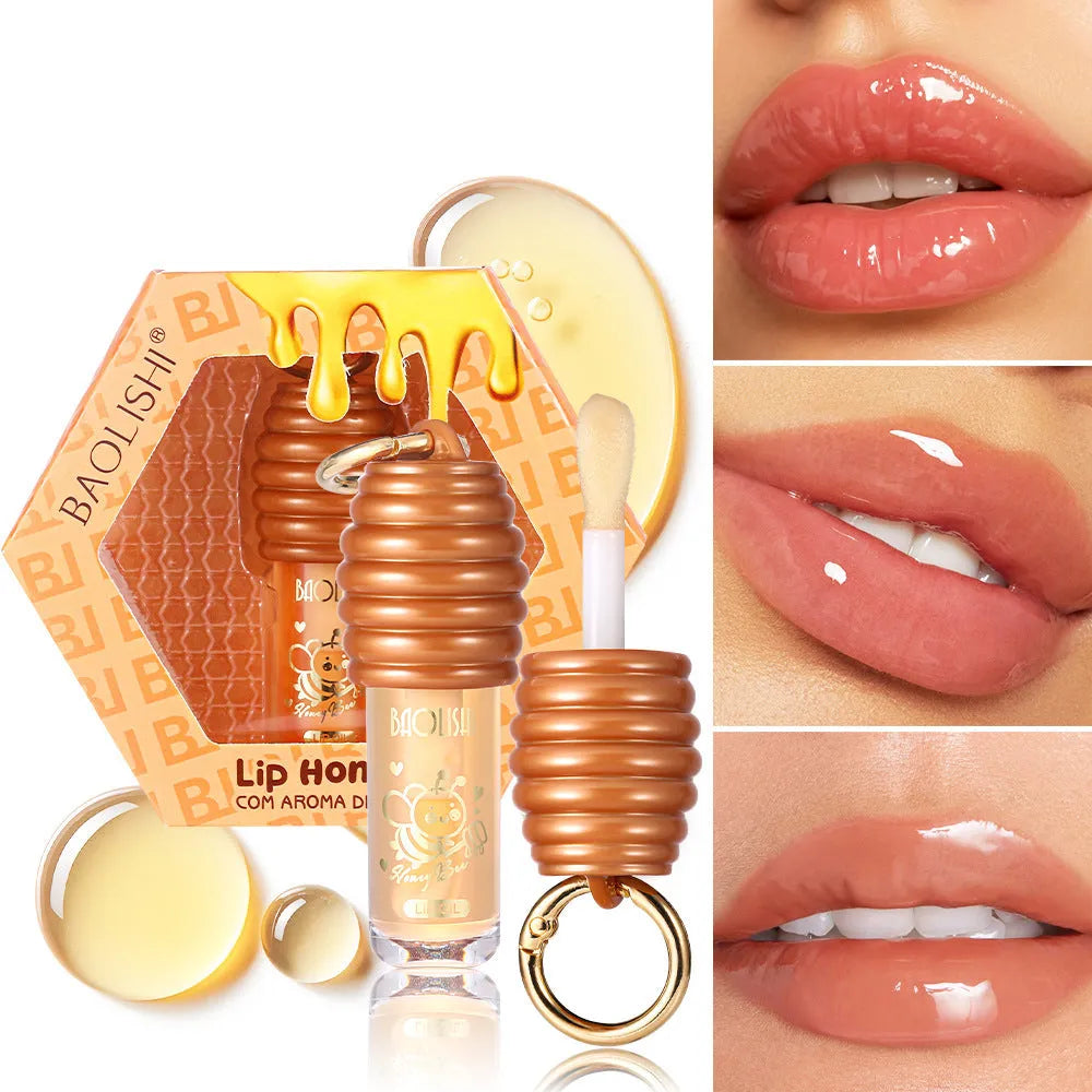 Honey lip gloss in portable keychain container for moisturising lip care