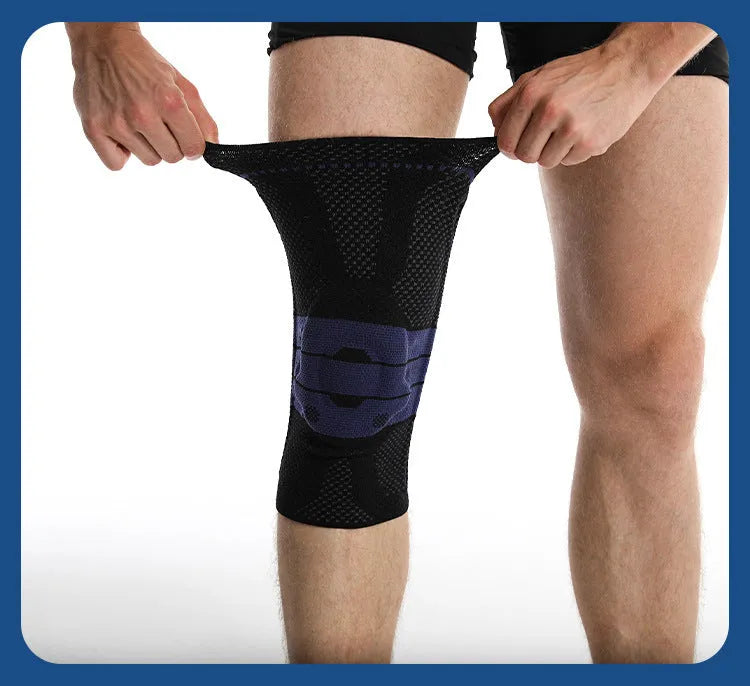 Adult sports knee pads in black and blue colour, shown on a knee for size reference.
