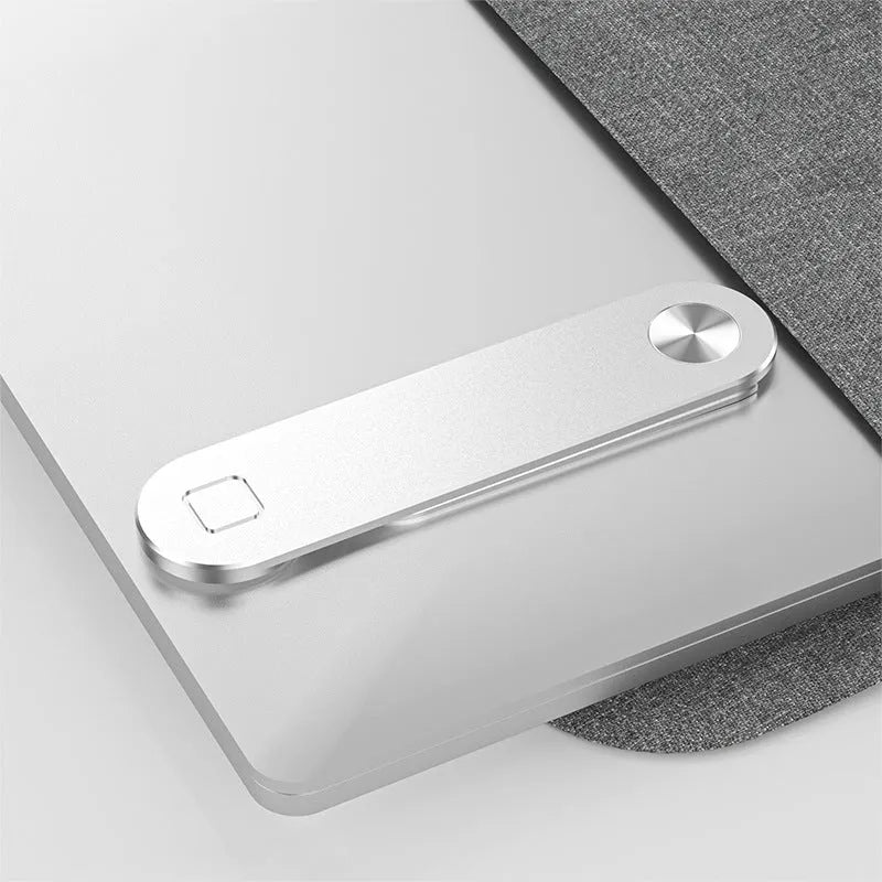 Black magnetic laptop phone holder with adjustable clip mounted on computer monitor