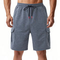 Men's loose fit cargo shorts in terry fabric with multiple pockets available in light grey, black, and dark grey colours