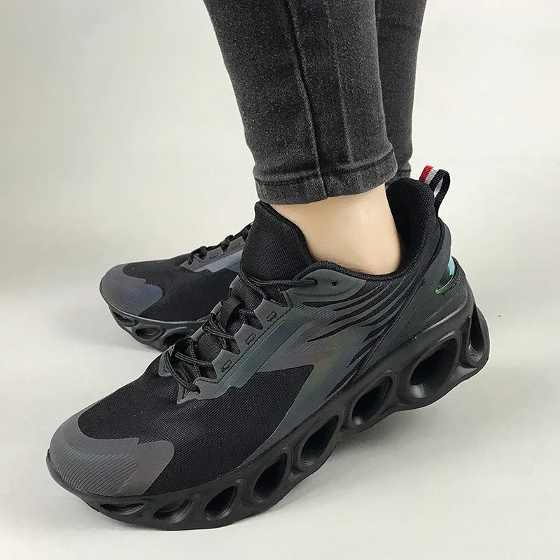 Men's black breathable mesh casual sports trainers with lace-up front and white EVA sole.