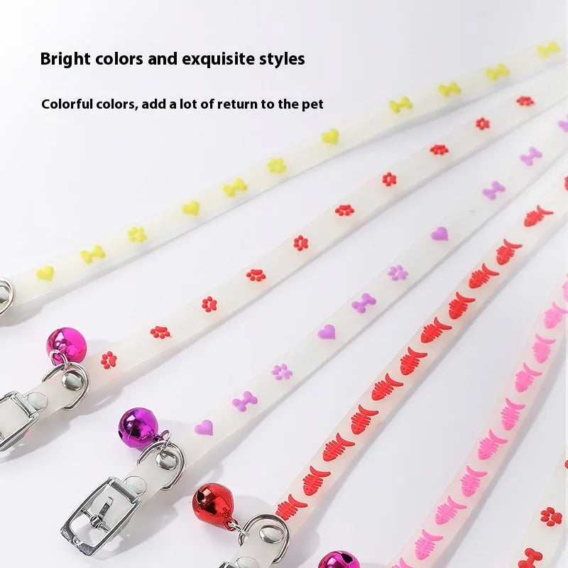 Glow in the dark cat collar with adjustable silicone chain and metal bell in paw print design