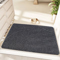 Green cartoon alien pattern diatom oil floor mat measuring 60 by 90 centimetres with a wire ring shape.