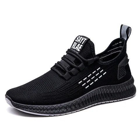 Men's black casual trainers with Flying Weave upper and cross strap detail on low-top sports shoes