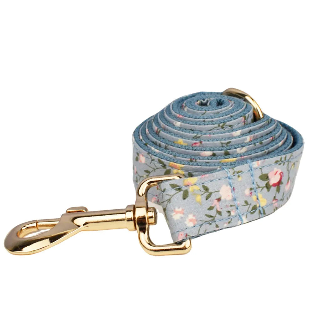 Blue floral polyester cotton dog collar set with matching leash, bow tie and vest accessories
