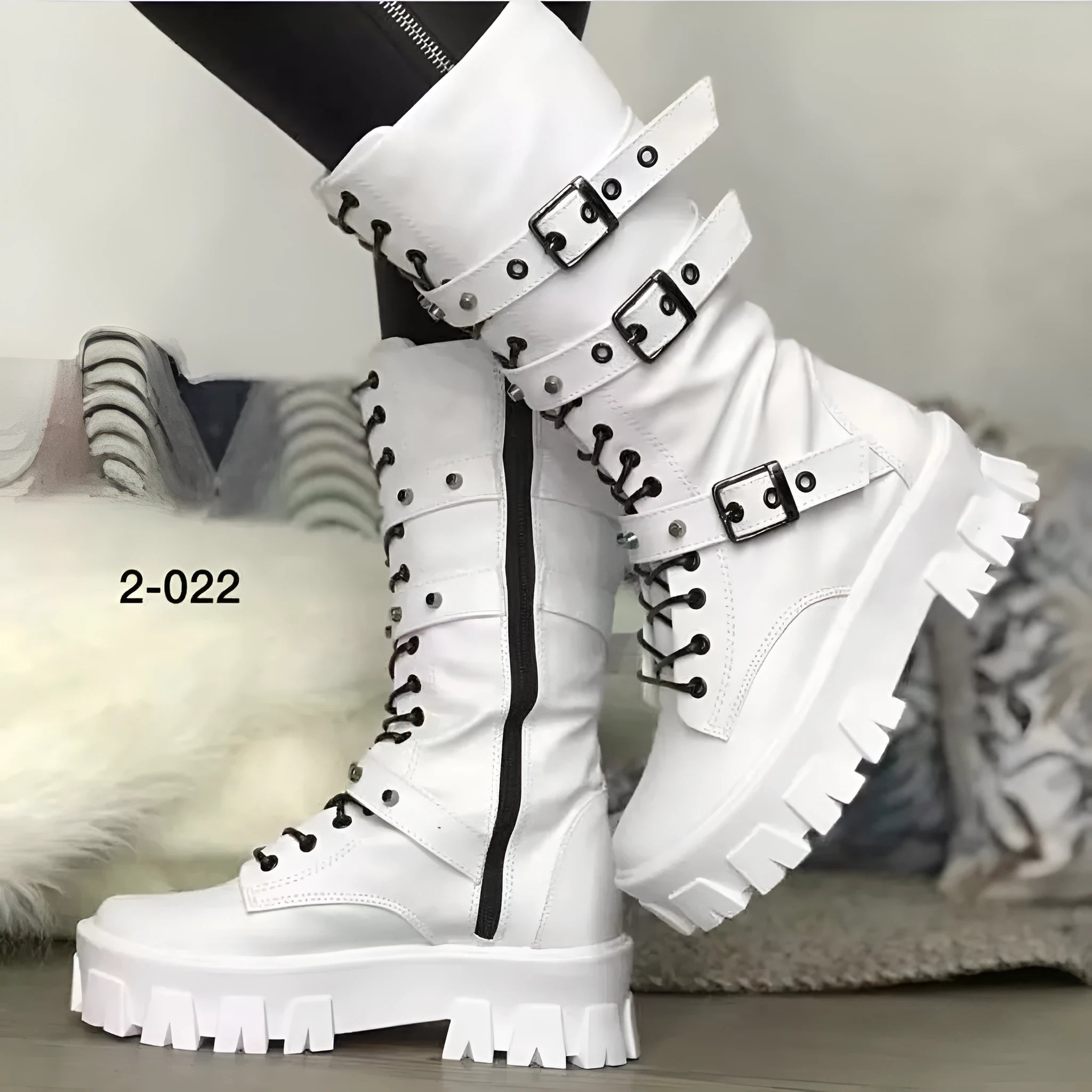 Women's black mid-calf knight boots with side zipper and metal belt buckle on artificial PU upper.