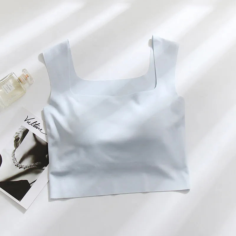 Women's non-marking nylon sling vest with chest pad in light blue, showing seamless beauty back design.