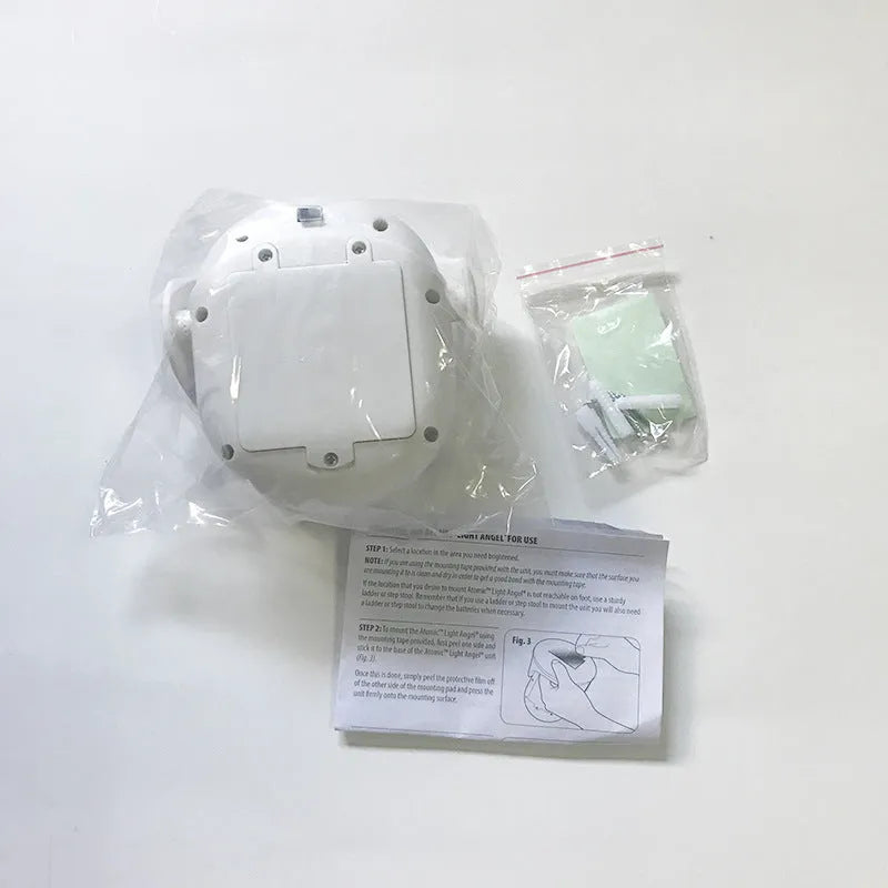 White Atomic Angel induction-powered night light with compact ABS plastic body.