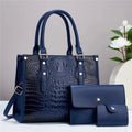 Women's burgundy PU leather bucket crossbody bag set with matching wallet and card holder.