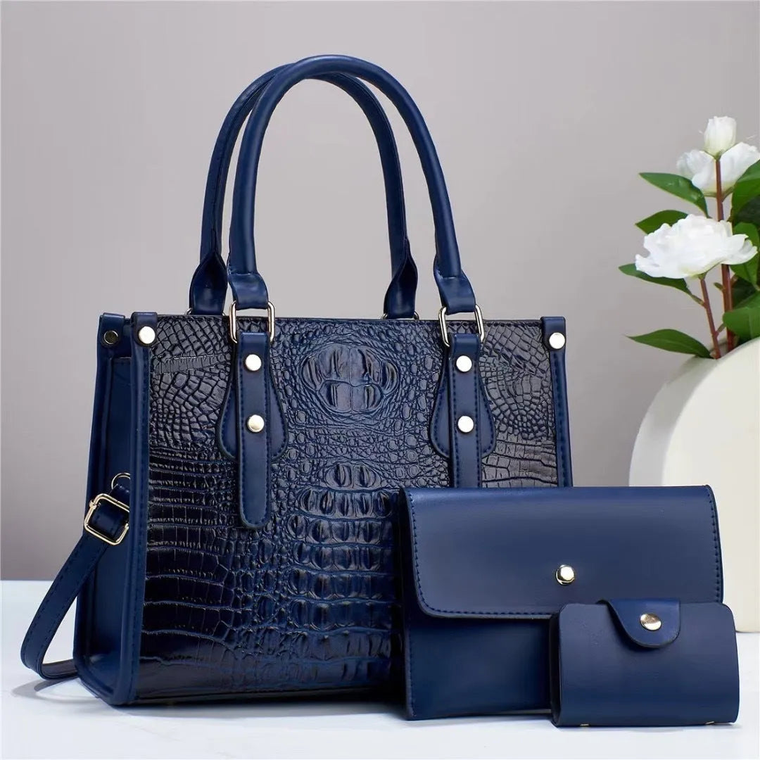 Women's burgundy PU leather bucket crossbody bag set with matching wallet and card holder.