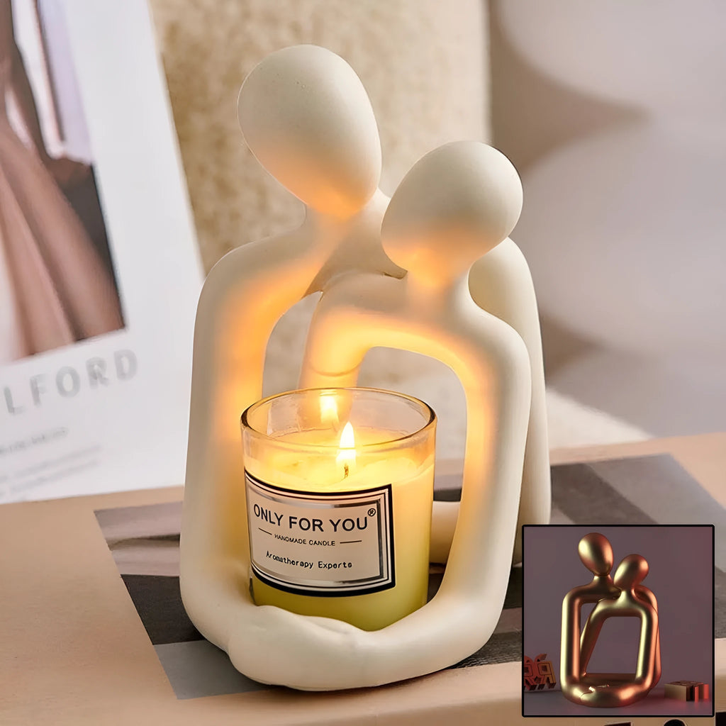 Modern minimalist loving couple resin statue in Gold or Milky White finish on a wooden surface.