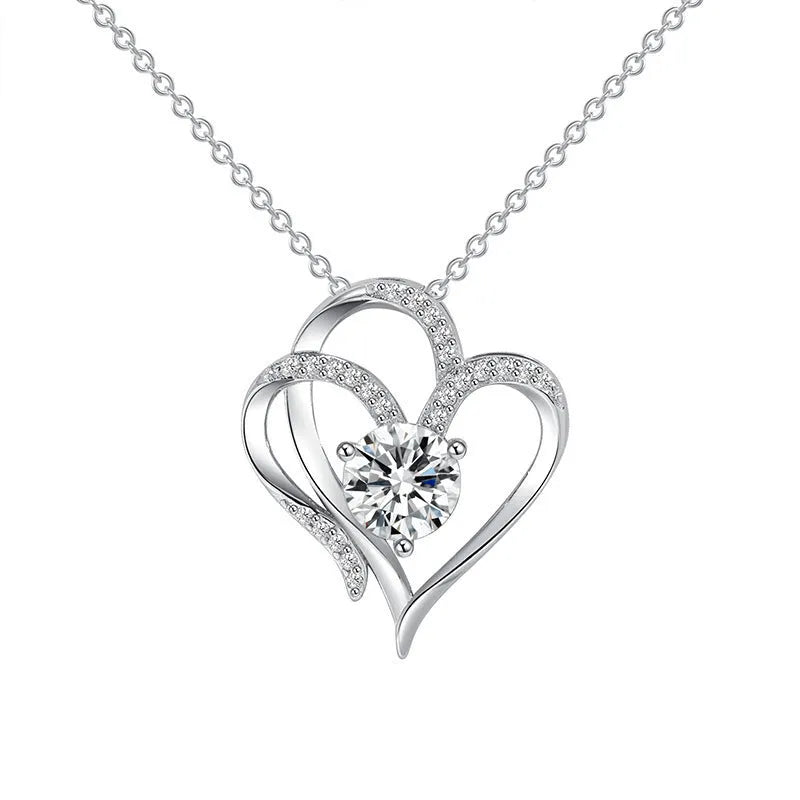 Close-up of a women's heart-shaped pendant necklace in 925 silver with a choice of gold tone finishes.