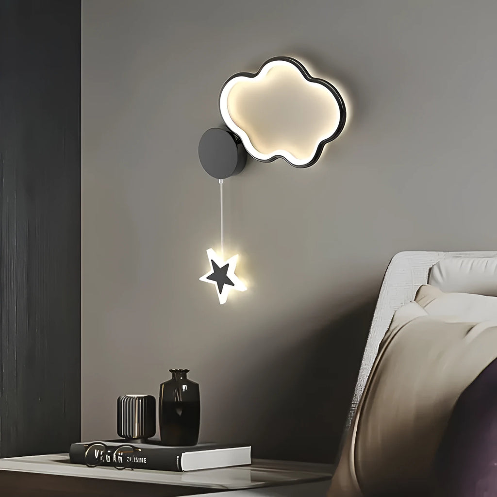A white cloud-themed children's wall lamp with a left-facing orientation and LED light mounted on a bedroom wall.