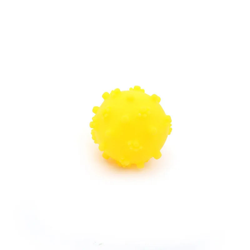 Bright blue, green, pink and yellow spiky dog balls with paw print dimples for small breed chewing and fetch.