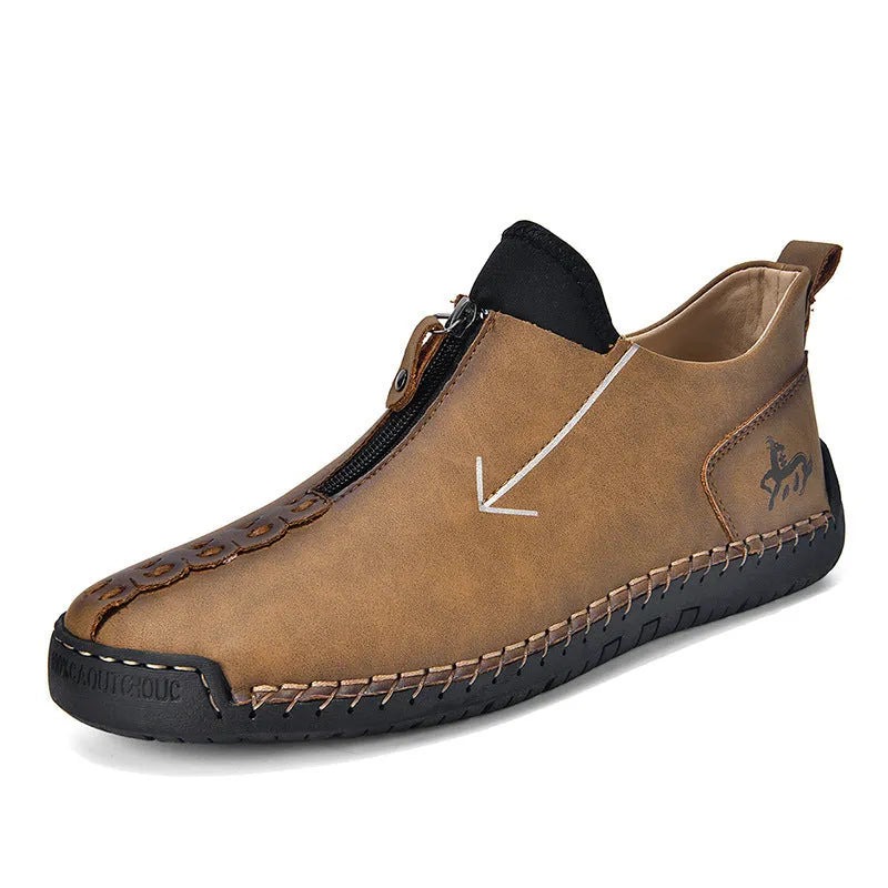 Men's black zip-up Martin boot with round toe and low heel on a white background.
