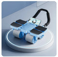 Black automatic rebound abdominal wheel with four wheels on a floor.