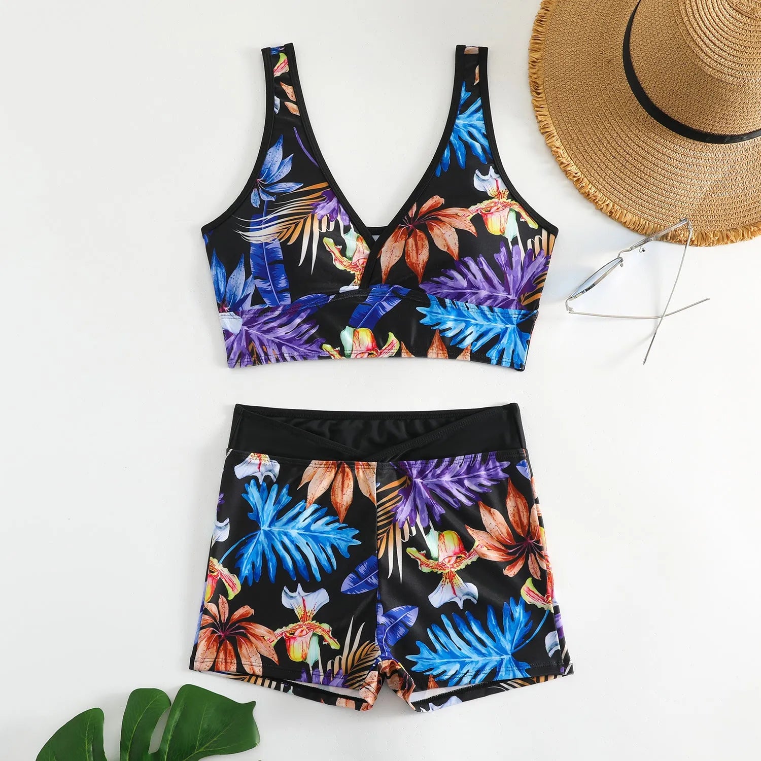 Women's two-piece swimsuit set with sleeveless top and printed boxer-style briefs in multiple colours.