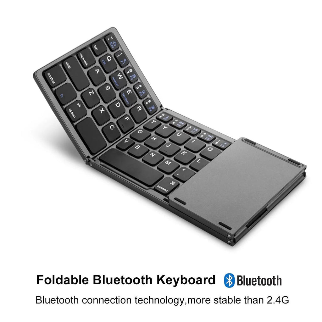 Black mini tri-fold Bluetooth keyboard shown folded and unfolded next to a mobile phone.