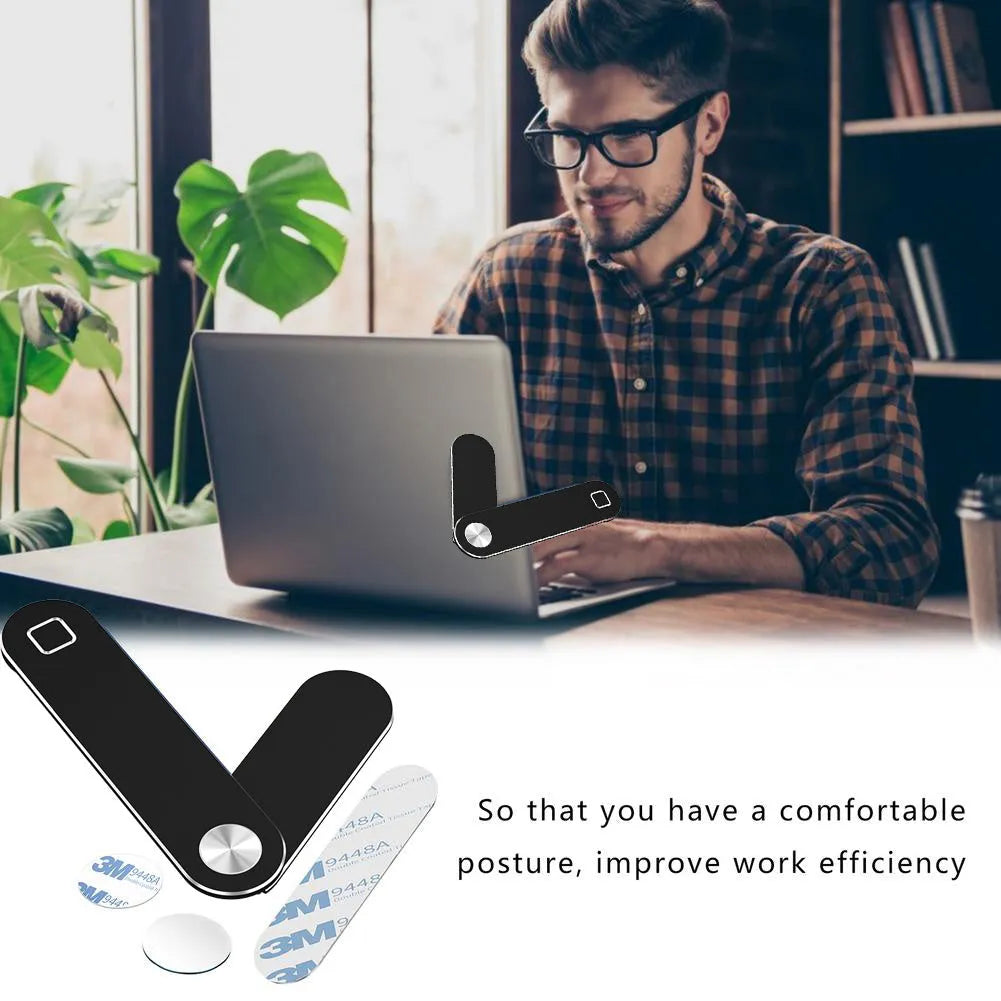 Black magnetic laptop phone holder with adjustable clip mounted on computer monitor