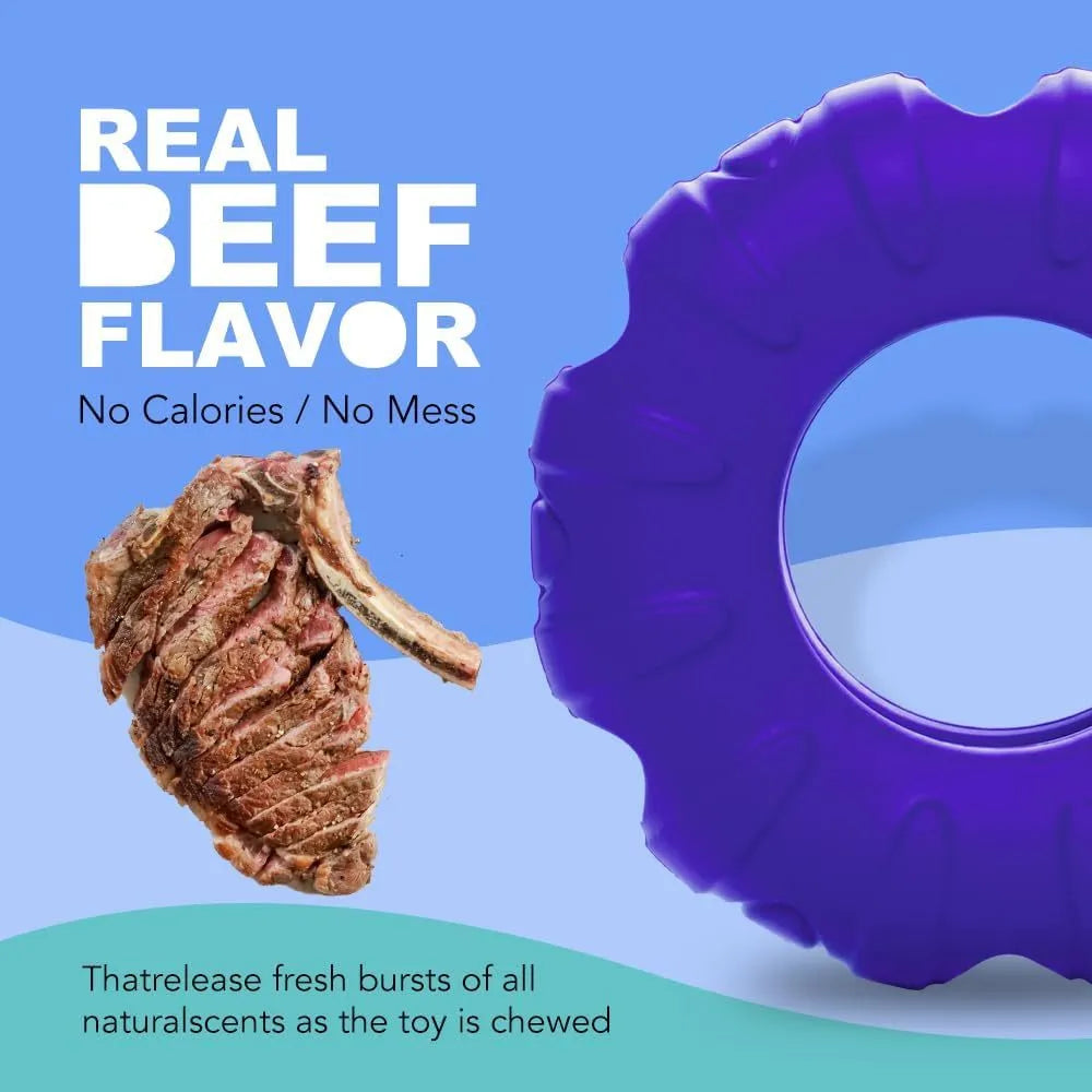 Blue natural rubber tyre-shaped dog chew toy and slow feeder on a wooden floor