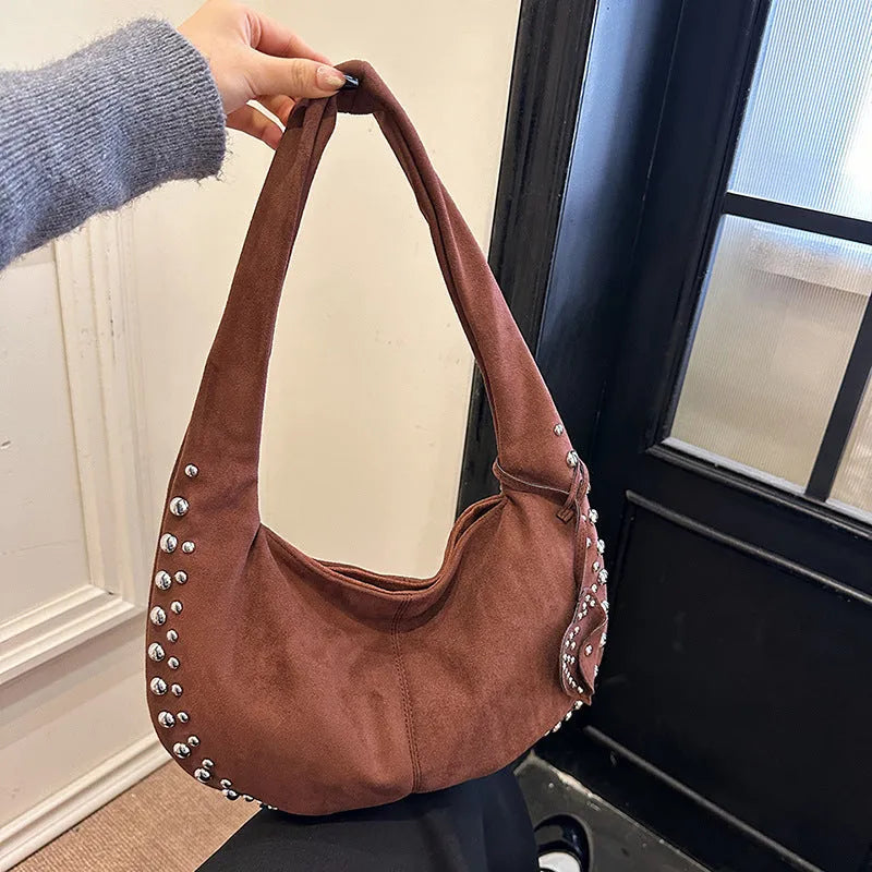 Women's soft plush tote handbag in retro styling with strapless underarm design