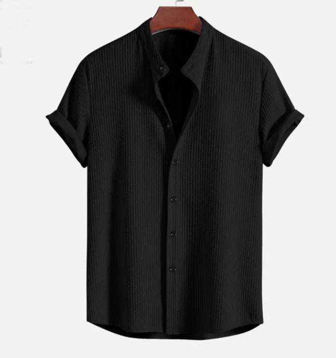 Men's loose fit short sleeve polyester summer shirt on a hanger, shown in a light blue colour.