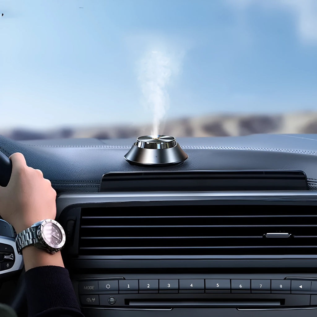 Black metal butterfly-shaped car aromatherapy diffuser with USB cable and essential oil bottle