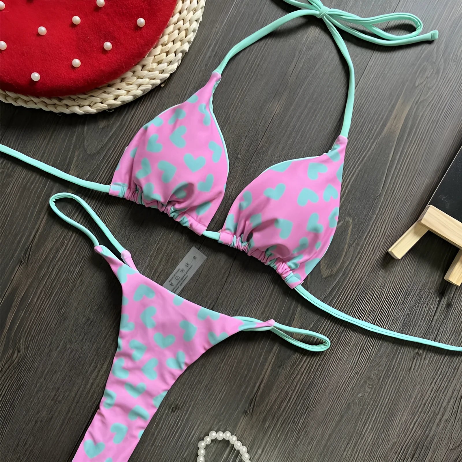 Heart printing backless split swimsuit in nylon fabric with cotton lining, available in sizes S, M, L