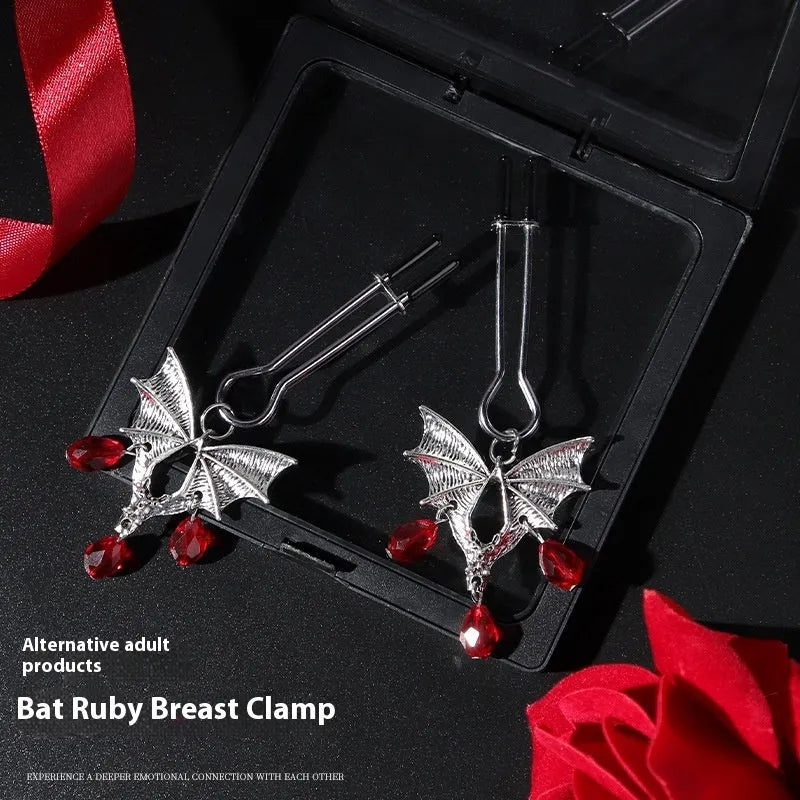 Silver alloy diamond bat nipple clamp set with ruby clip details and adjustable tension mechanism