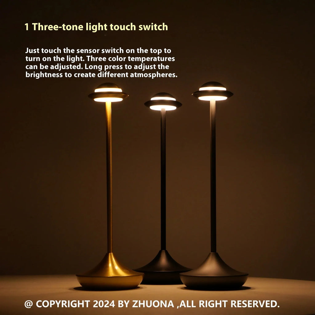 UFO-shaped rechargeable table lamp with touch controls in metallic finish