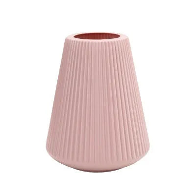 Colourful melamine plastic decorative flower vase measuring 16cm by 20cm on a desktop.