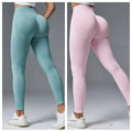 Women's peach hip tight mid waist yoga pants in a cotton blend fabric, shown in a light green colour.