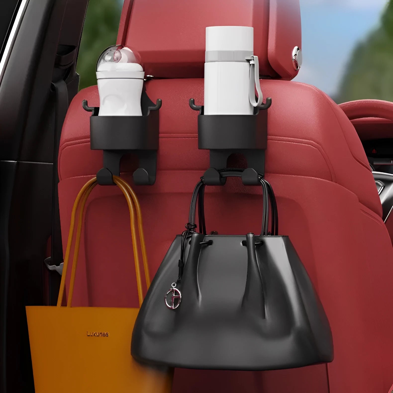 Black plastic car seat back organiser with cup holder and storage hooks for vehicle interior organisation