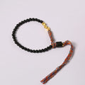 Hand-woven obsidian carrying strap bracelet showing braided detail and adjustable 15.5-16cm length