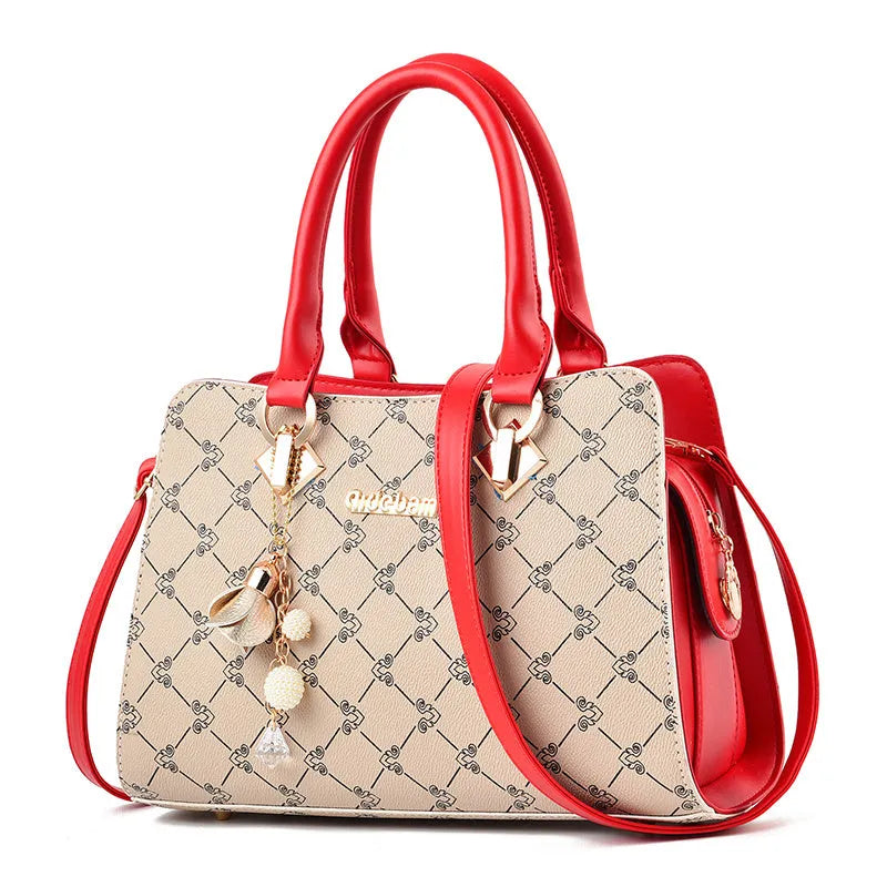 Women's geometric print PU leather messenger bag with internal organisers and zip closure.