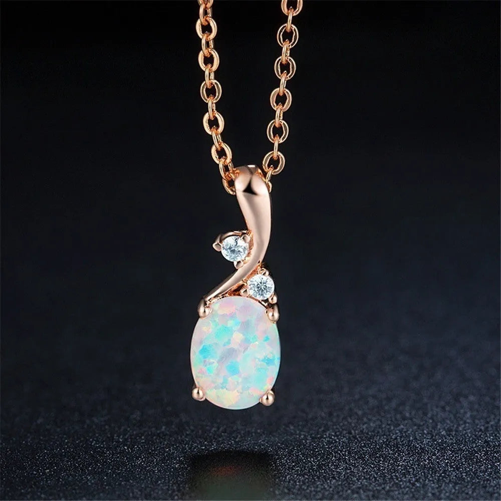 Water drop shaped opal pendant on adjustable chain necklace in rose gold or white finish