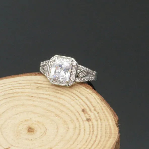 Geometric platinum colour zircon ring with quadrilateral design and hollow ornament construction
