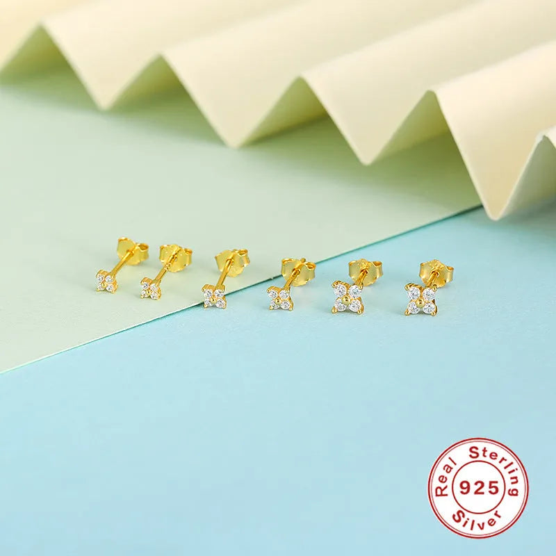 S925 sterling silver stud earrings with a small crystal flower design in gold or platinum plating.