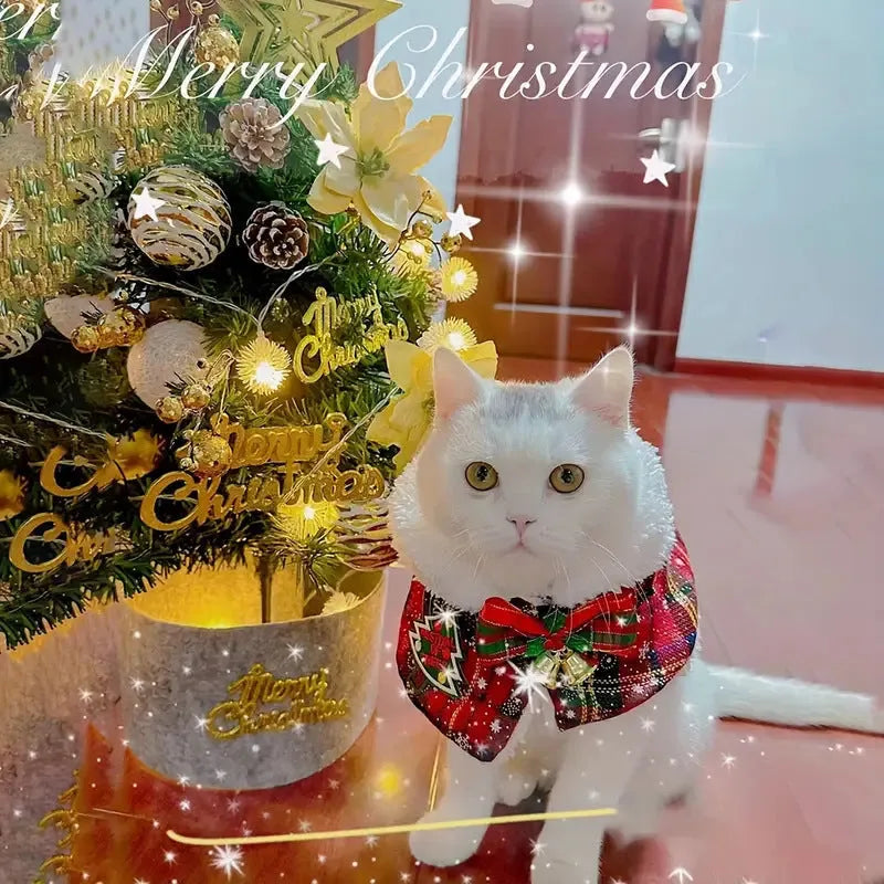 Red holiday pet scarf with bell motif wrapped around dog's neck for Christmas