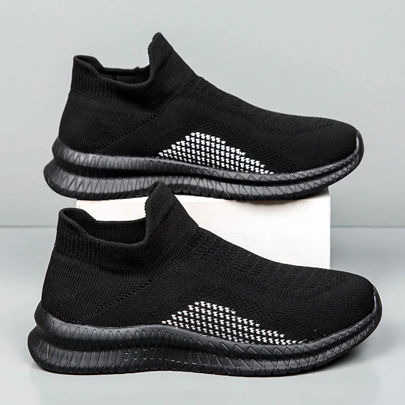 Popcorn Flyknit low top casual sneakers in white, black, and blue colours on a plain background.