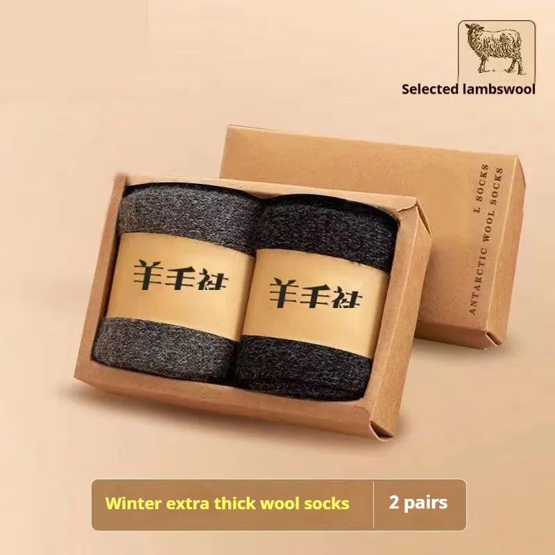 Pair of thick solid-colour wool socks with a merino midsole, shown with a storage box.