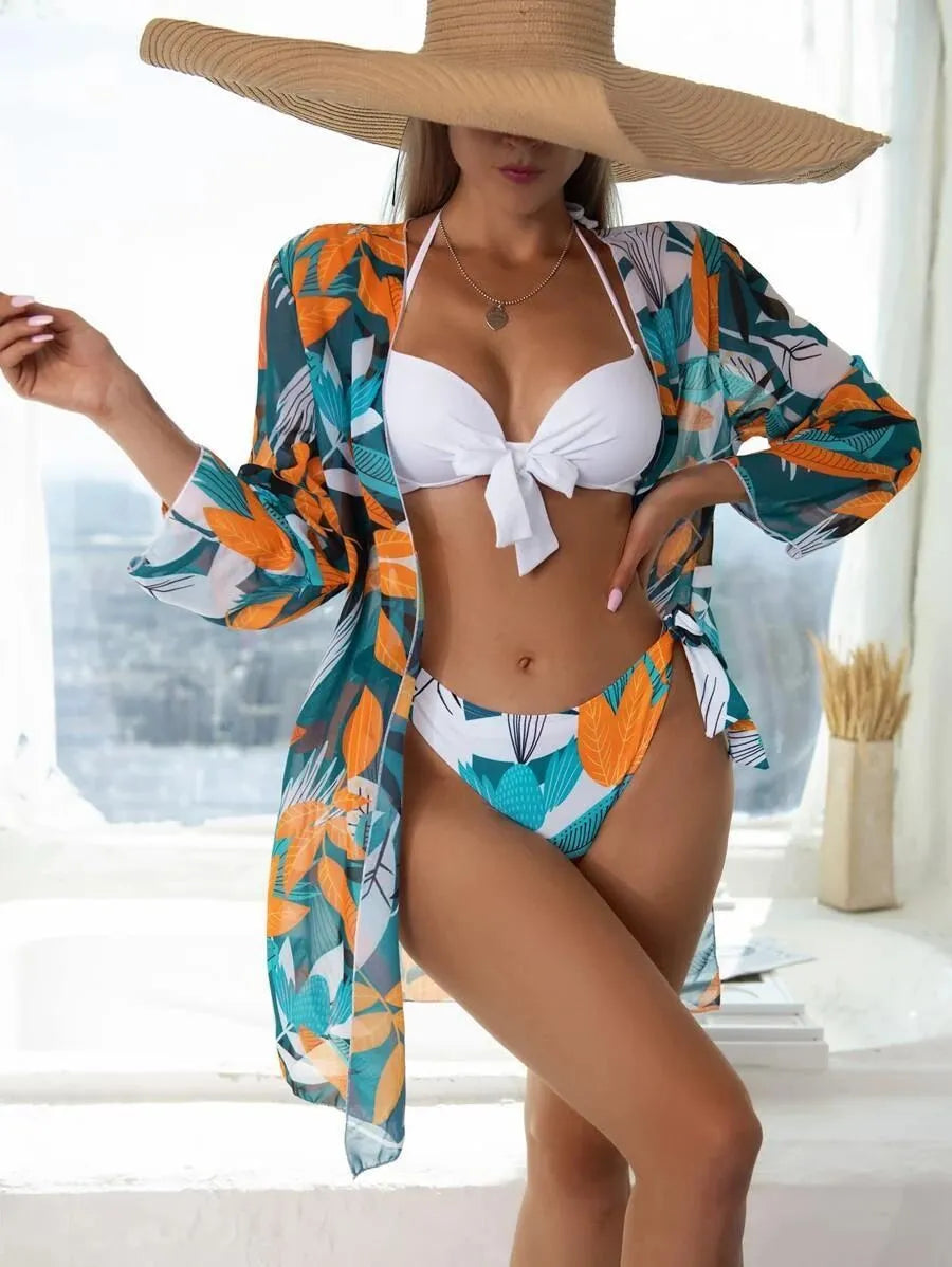 Women's three-piece bikini swimsuit set with mesh detail, including top, bottoms, and a matching coat.
