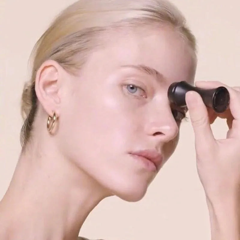Volcanic stone facial roller for oily skin control in black, green, pink, or white colours.