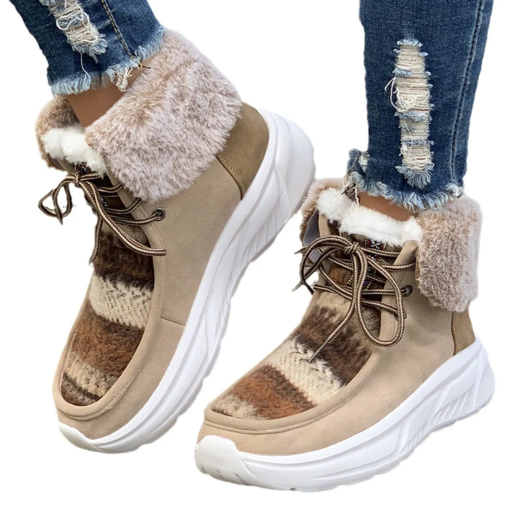 Women's beige lace-up suede snow boots with thermal lining and a thick rubber sole.