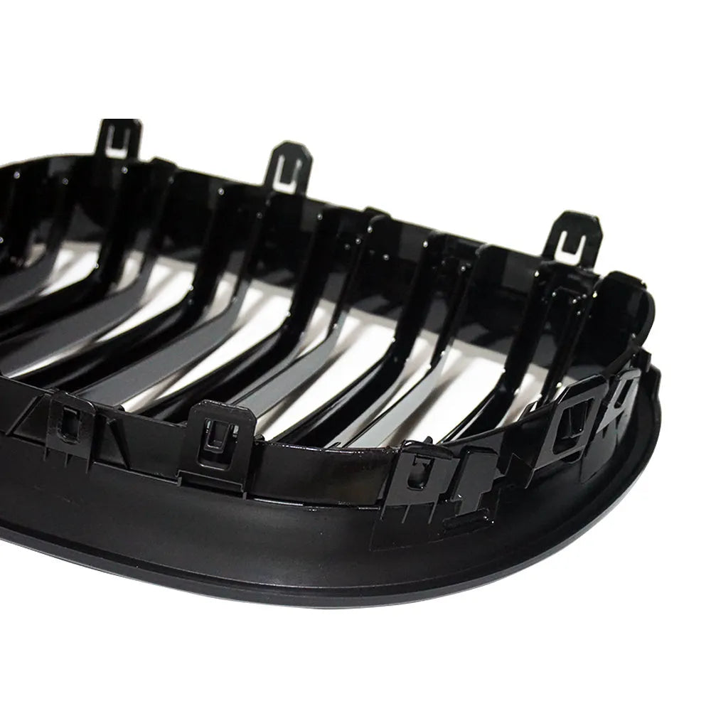 Carbon fibre pattern front grille for BMW 5-Series E60 E66 models on black background.
