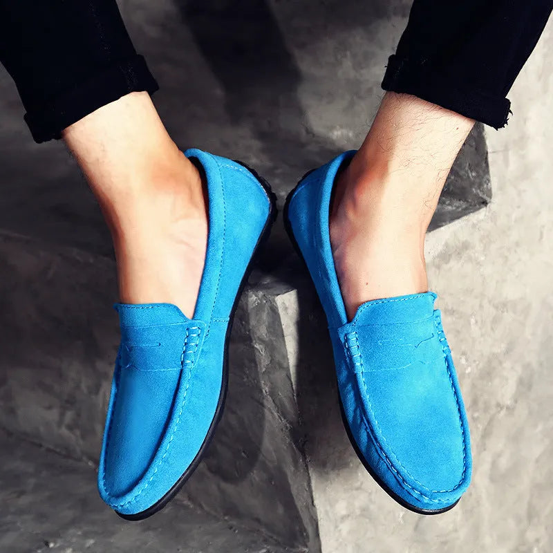 Men's brown suede casual loafers with a round toe and flat rubber sole on a white background.