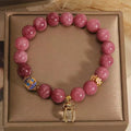 Women's natural stone bracelet with pink lotus tassel and pearl pendant design