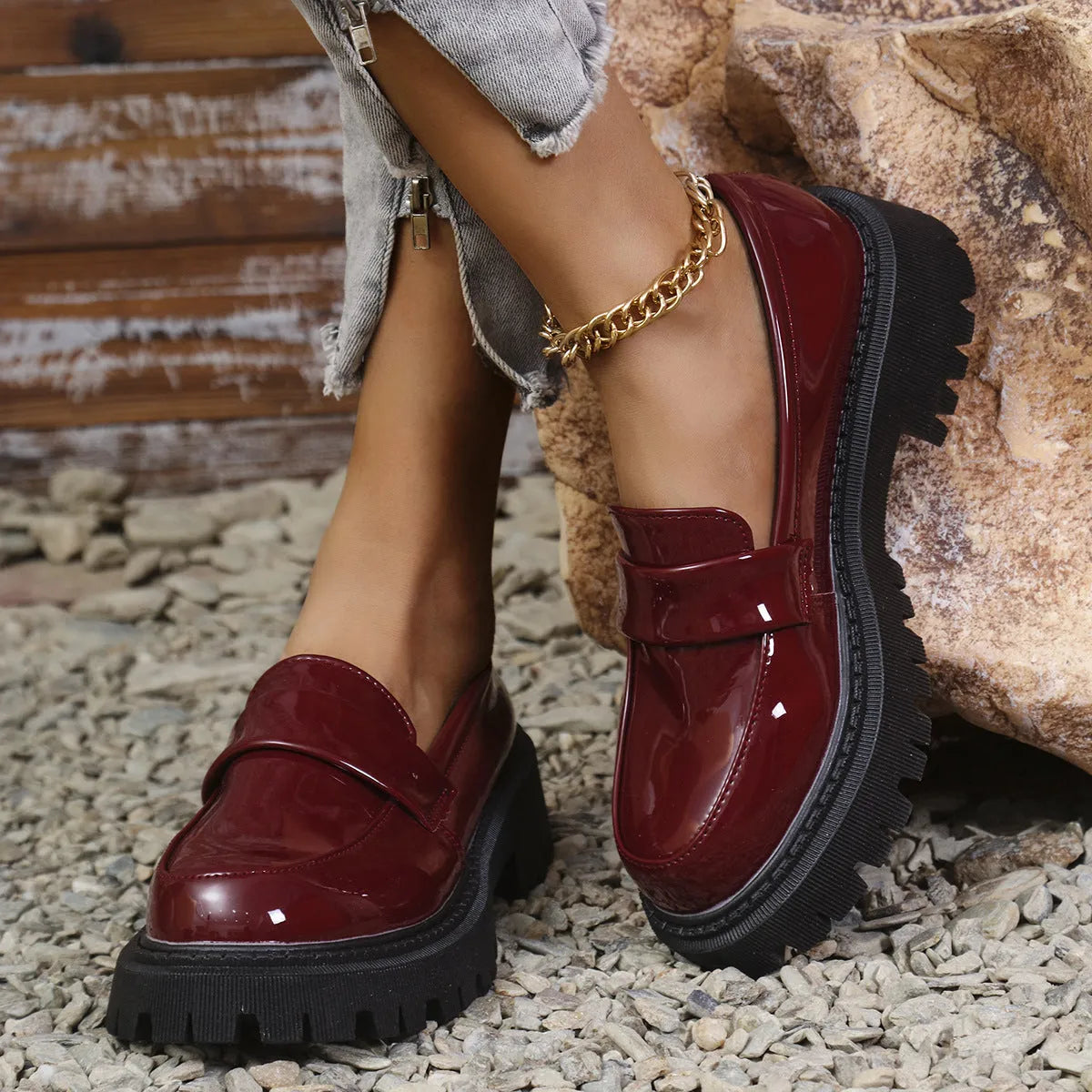 Plus size women's slip-on loafers with a chunky platform heel in black, green, and wine red colours.